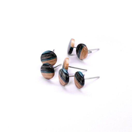 Black and blue round earrings made from recycled skateboard decks